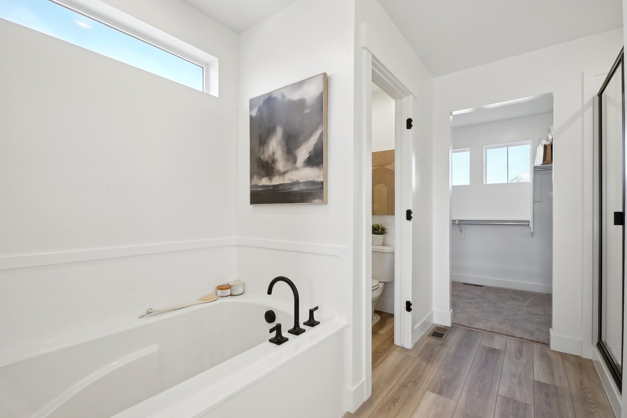 A bathroom with a tub and a sink.