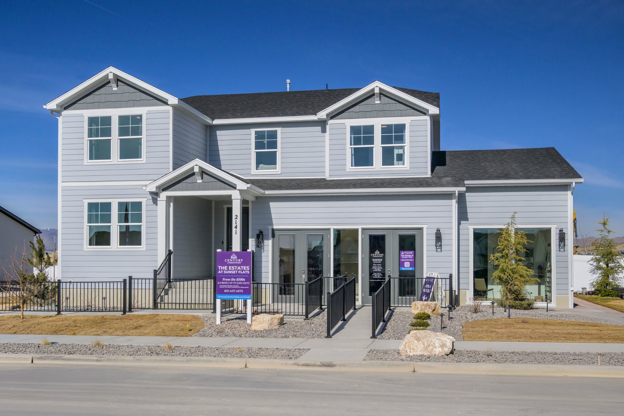 A house with a sign in front.