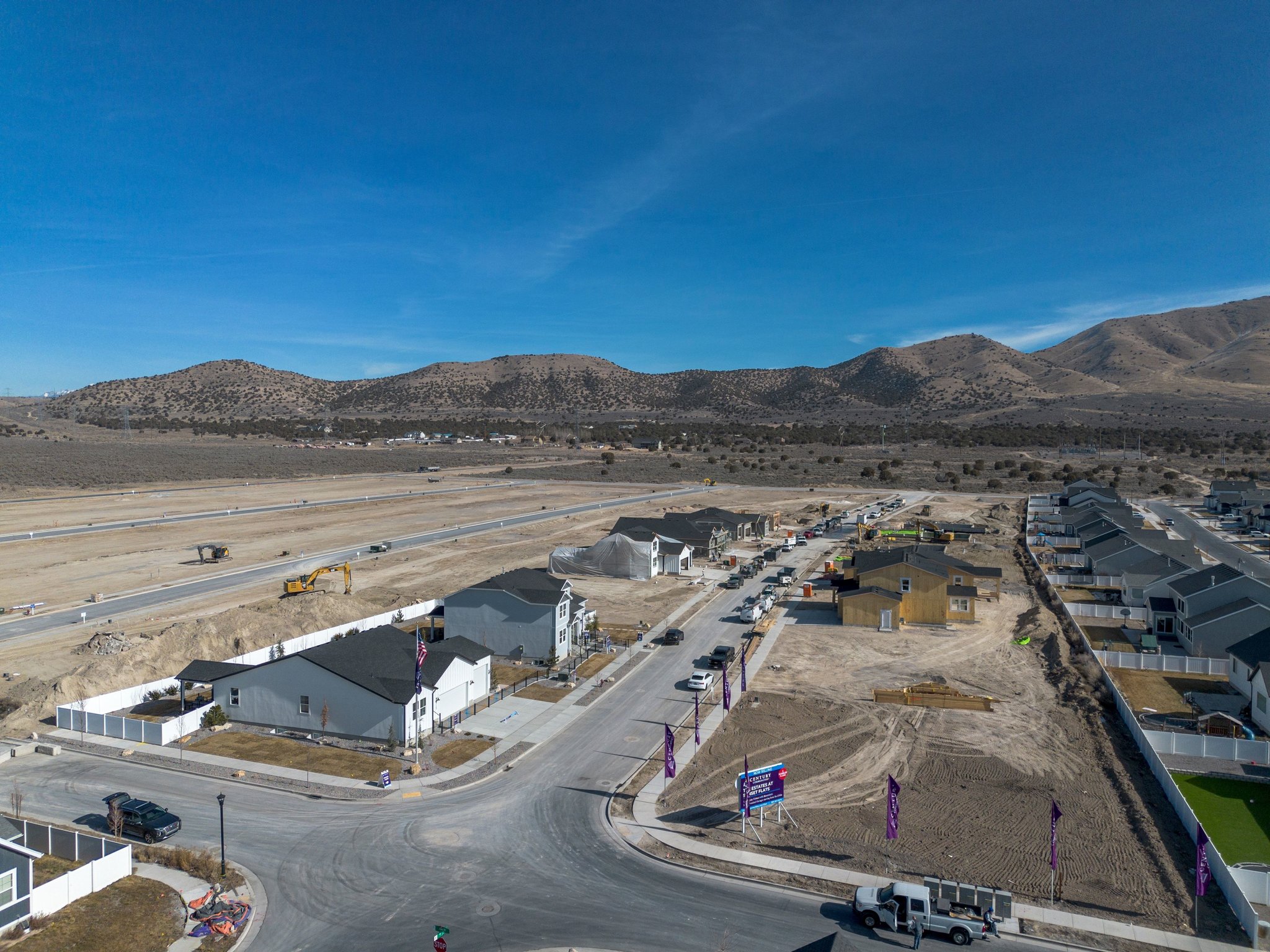 A large area with buildings and mountains in the background.
