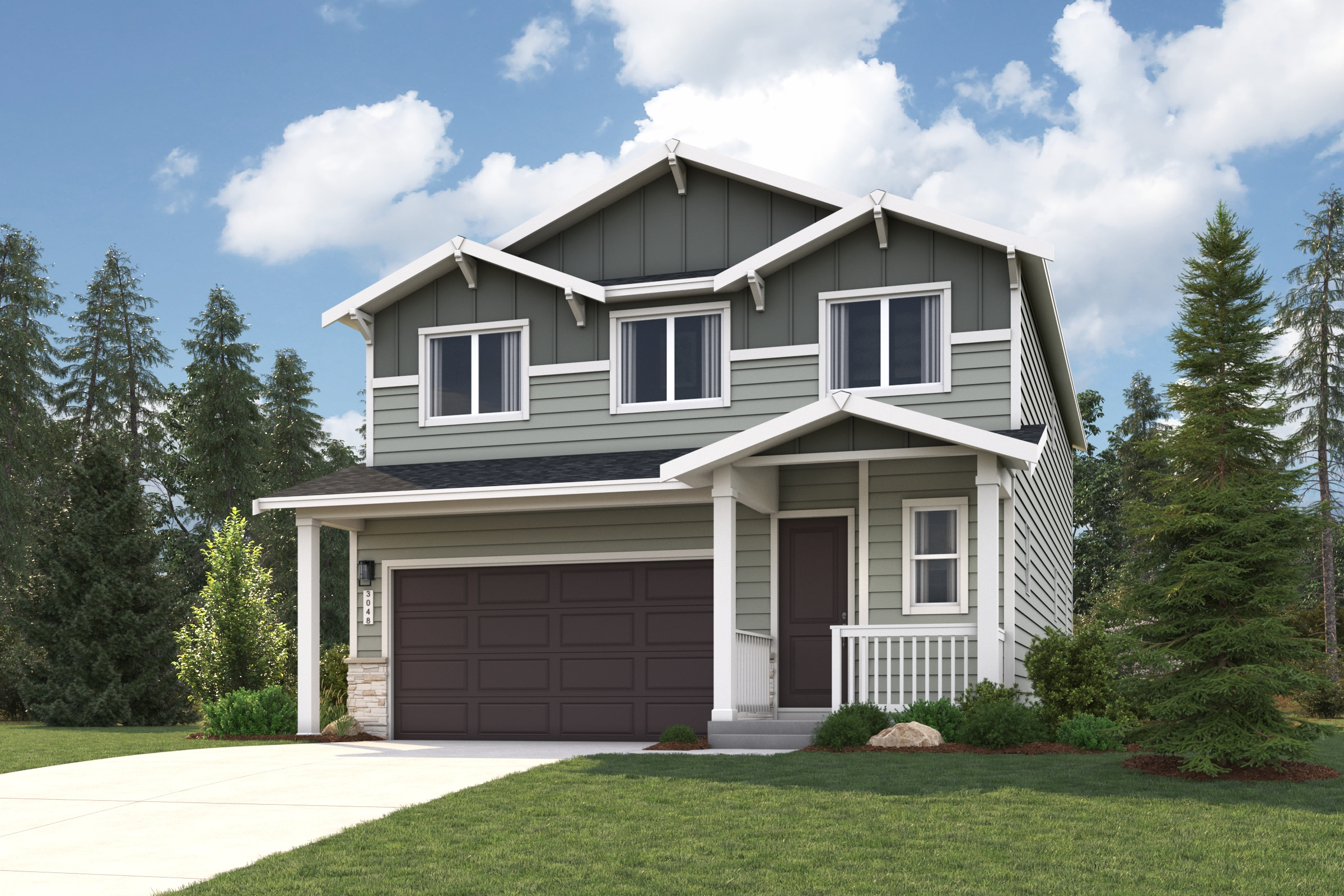 A house with a garage and trees around it.