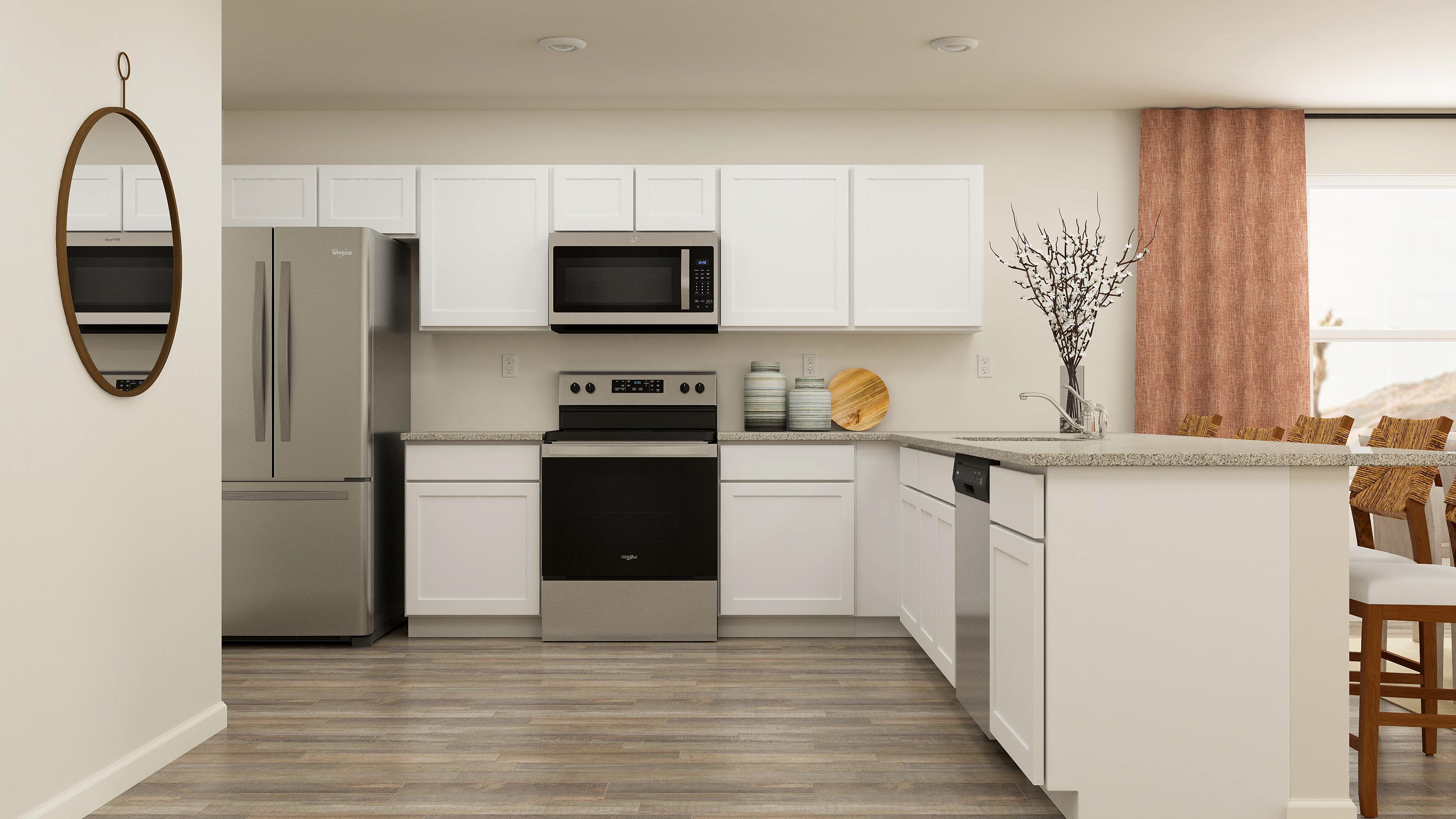 A kitchen with white cabinets.