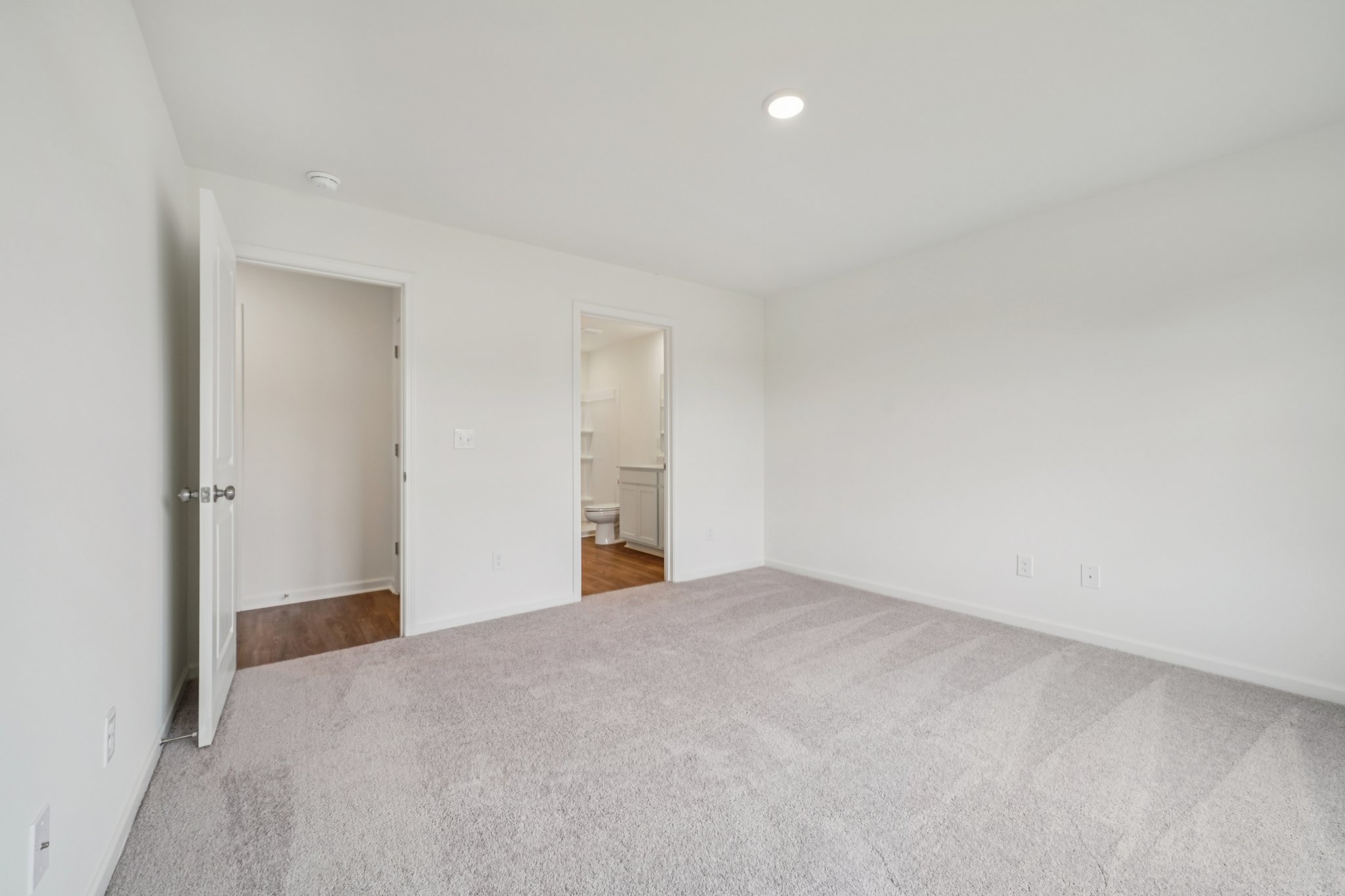 A hallway with white walls.