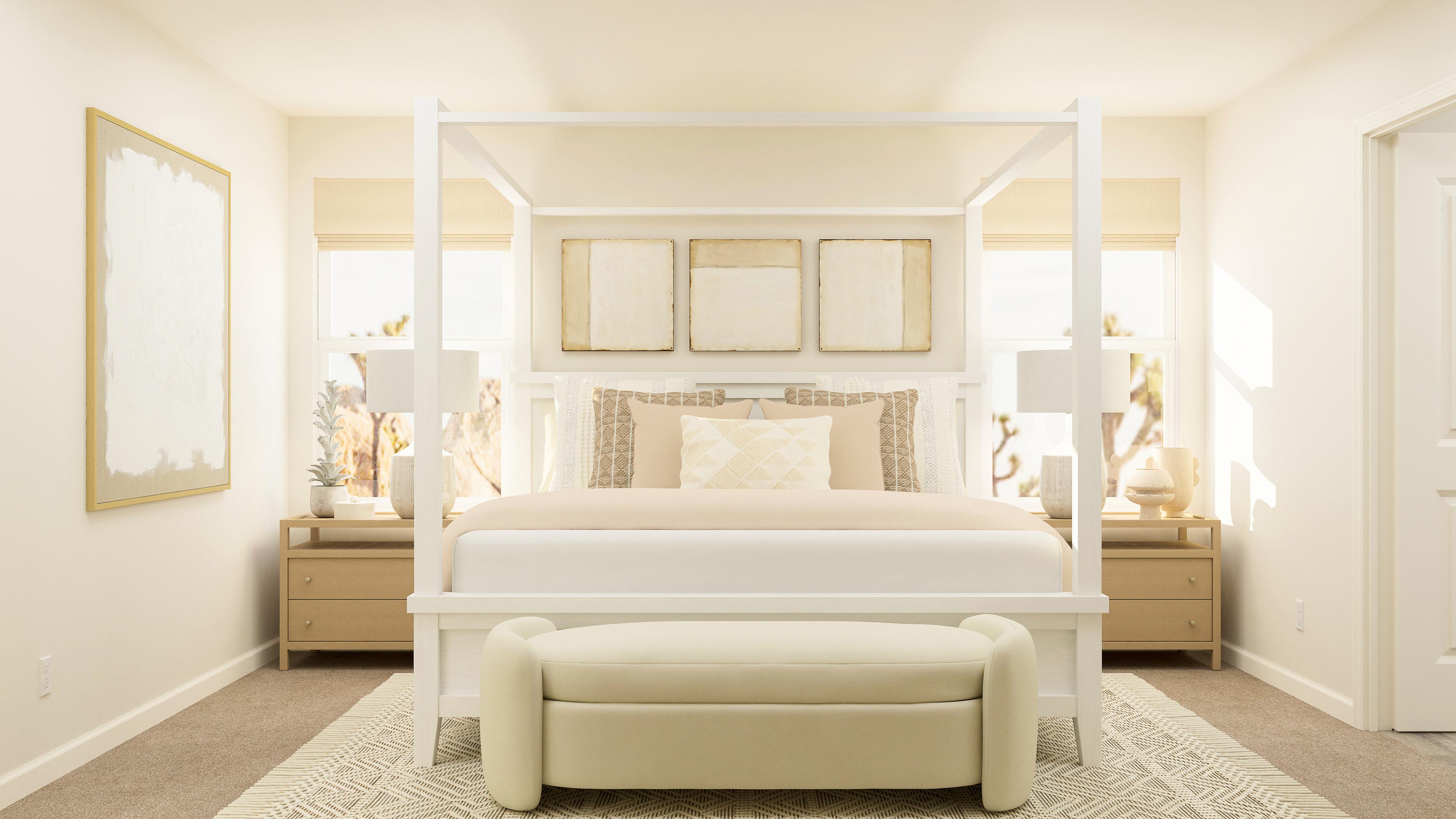 A white bed in a room.