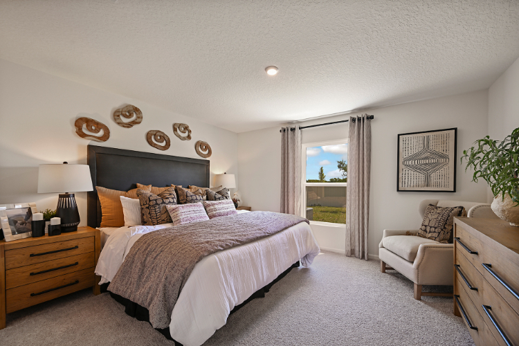 A bedroom with a large bed.