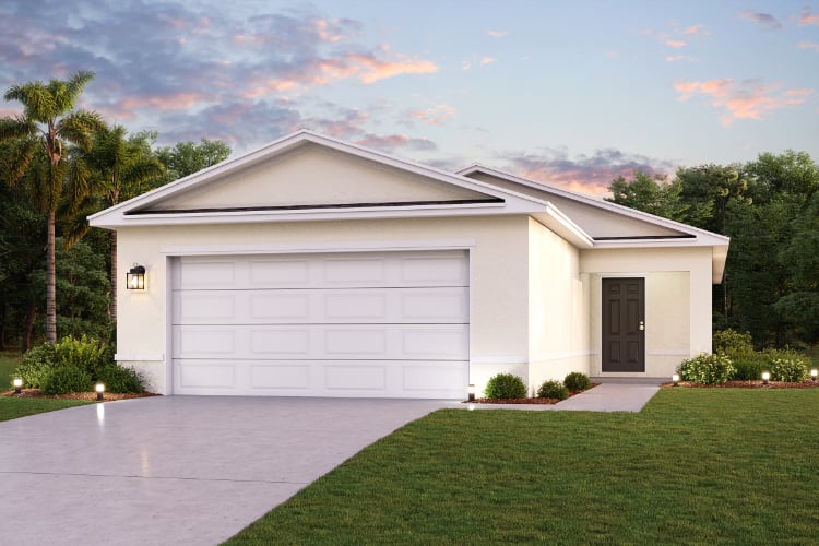 A white house with a driveway.