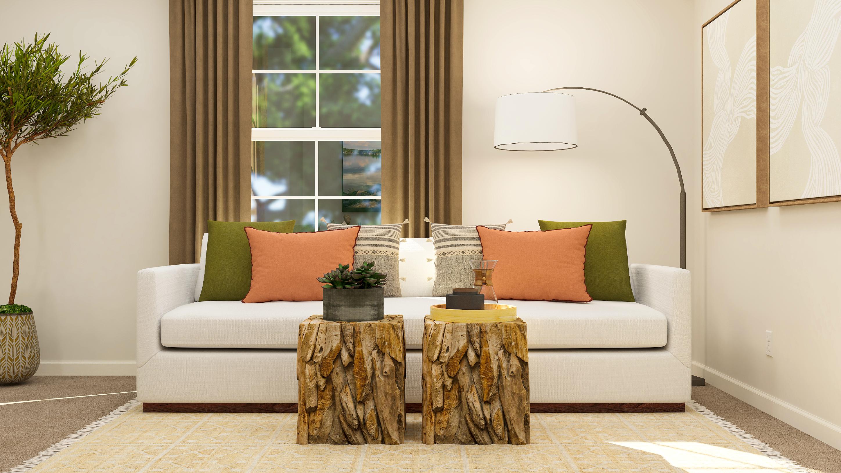 A couch with pillows and a coffee table in a room with a window.